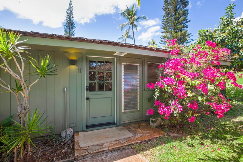 Tucked beneath palms and blooming colors, this charming retreat invites peaceful mornings and slow, sunny strolls