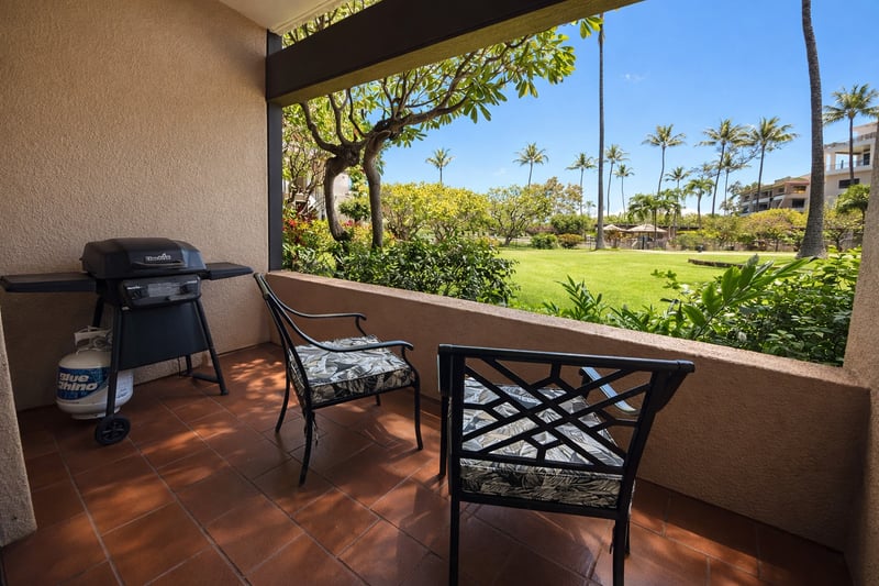 The lanai features a private bbq and relaxing area overlooking the grounds
