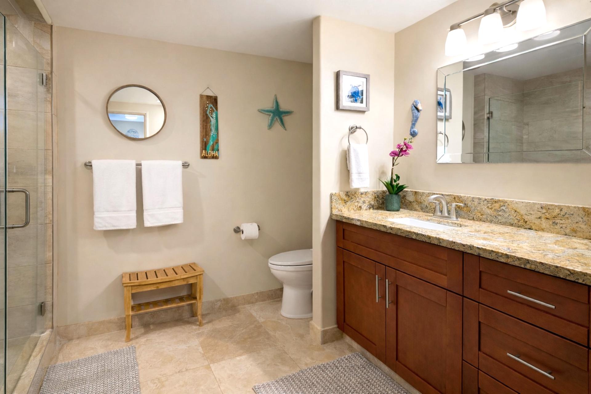 The master bath has a walk in glass shower and spacious countertops, making getting ready a breeze