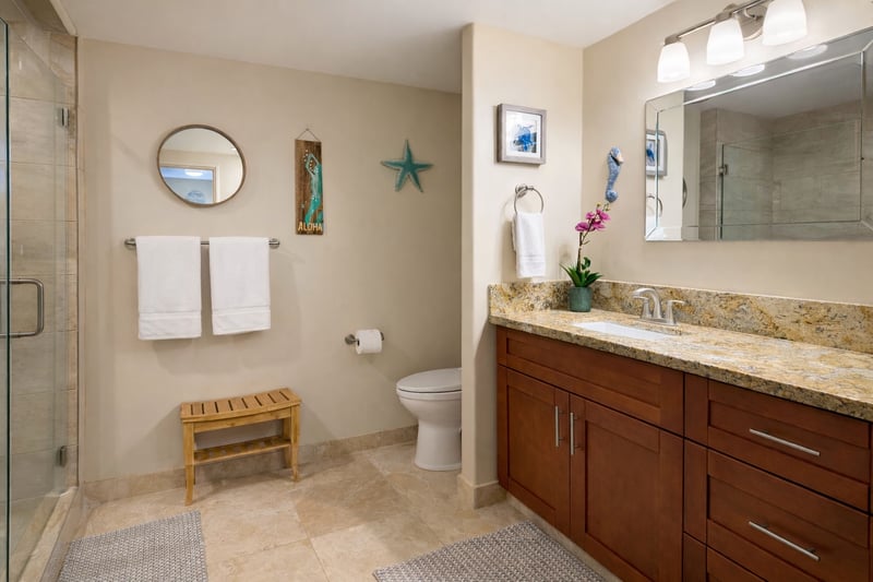 The master bath has a walk in glass shower and spacious countertops, making getting ready a breeze