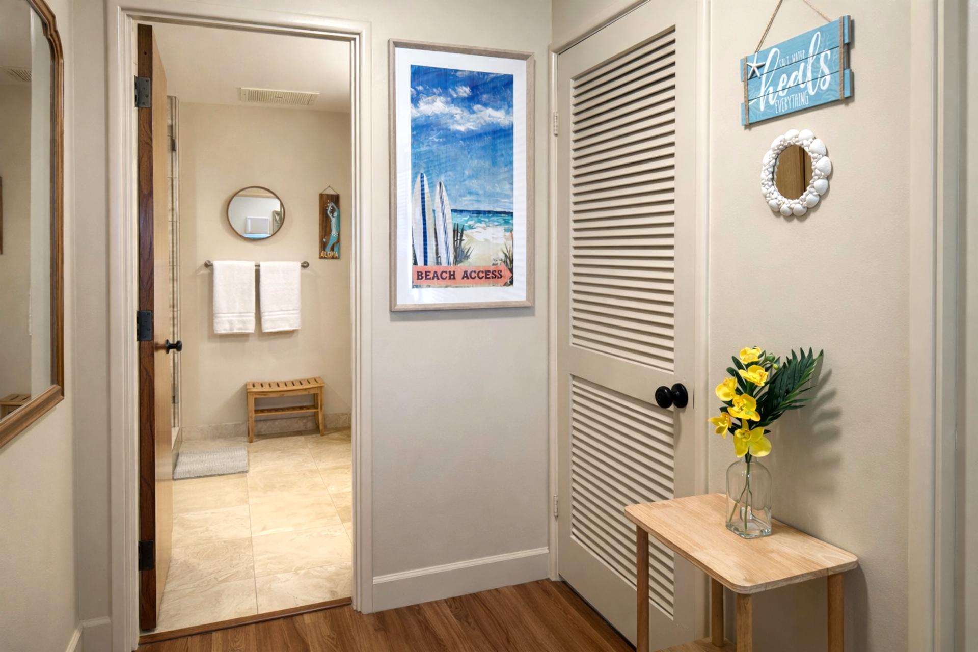 Unwind in the private bathroom off the primary suite after a day on the beach