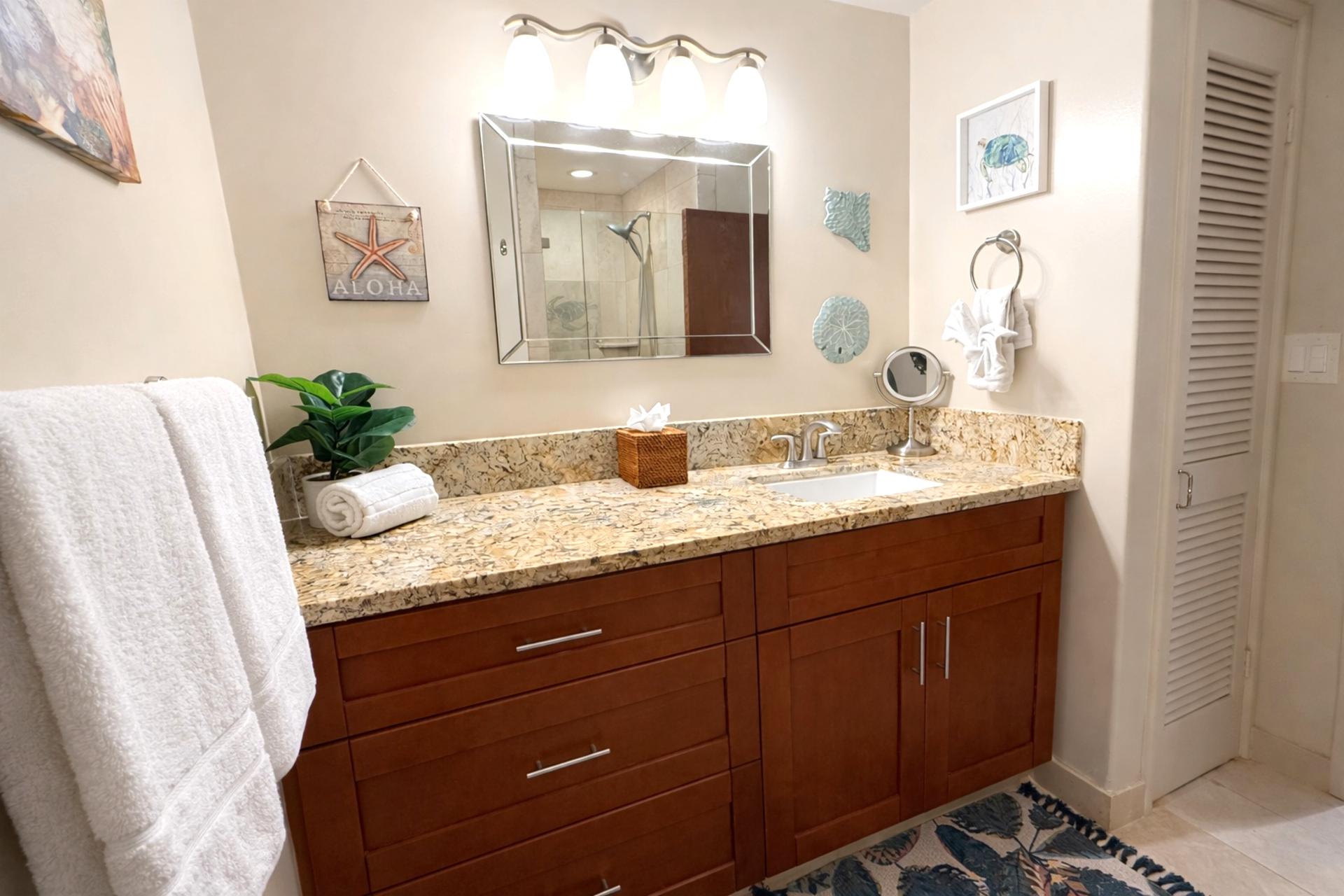 The well lit guest bath is the perfect place to get ready for the beach or a night out