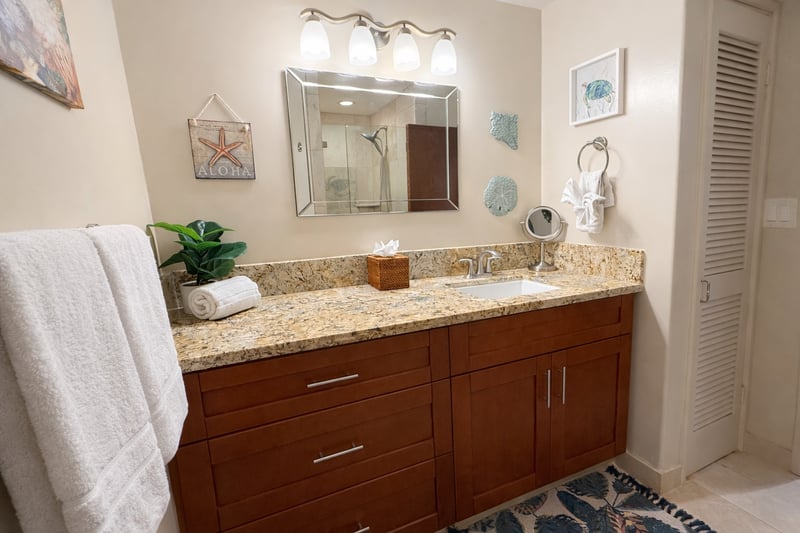 The well lit guest bath is the perfect place to get ready for the beach or a night out