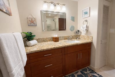 The well lit guest bath is the perfect place to get ready for the beach or a night out