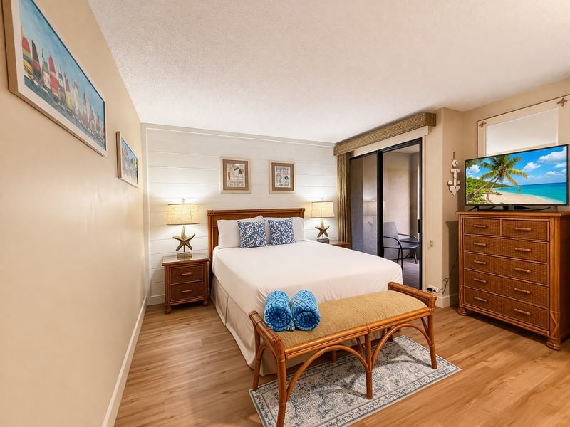 The guest bedroom features a comfortable queen size bed and premium linens