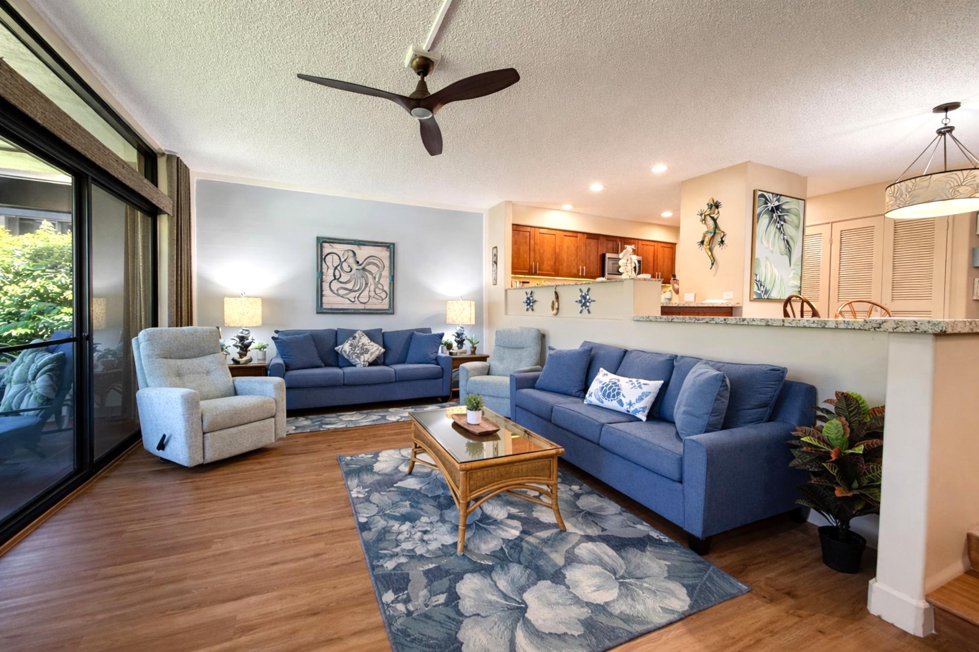 The open floor plan living space features ample comfortable seating 