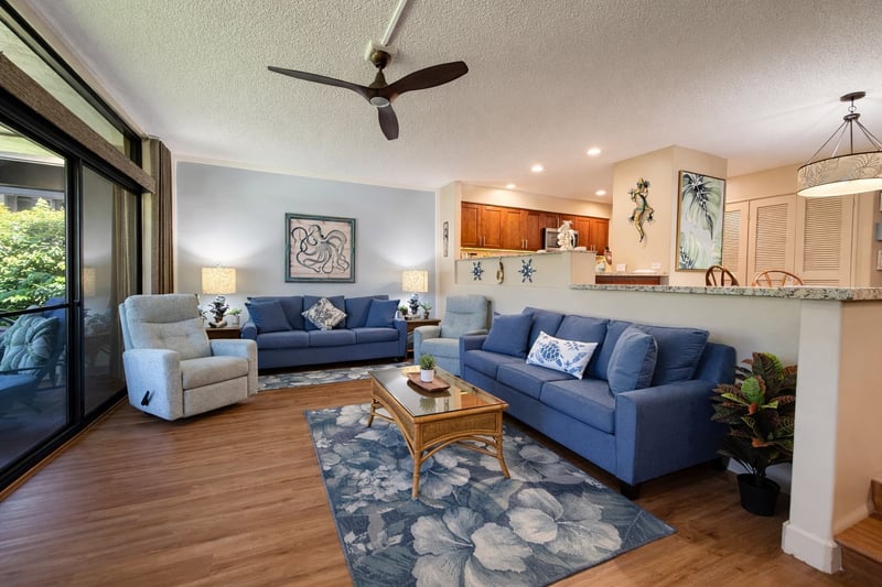 The open floor plan living space features ample comfortable seating 