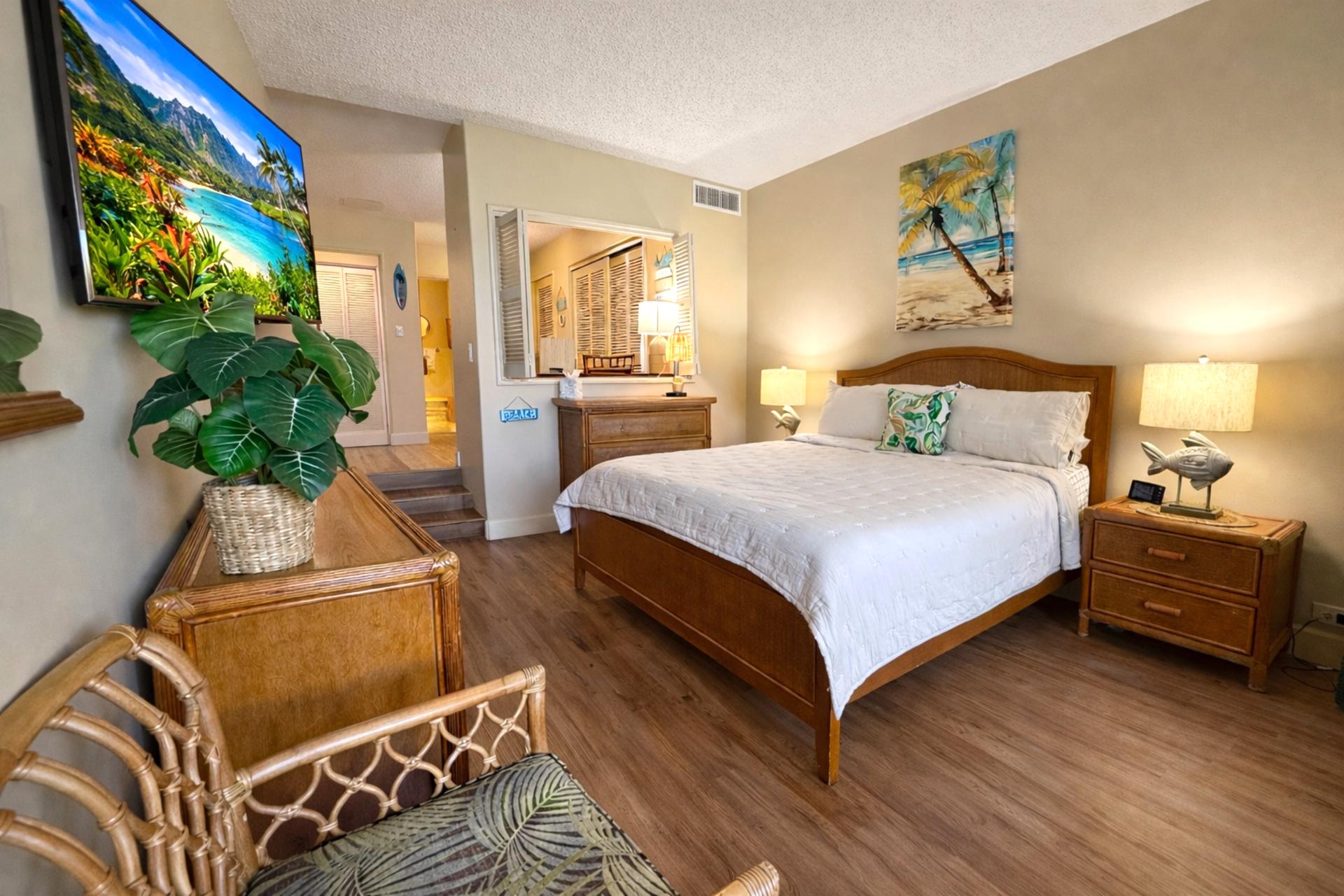The spacious primary suite features a comfortable king size bed with premium linens