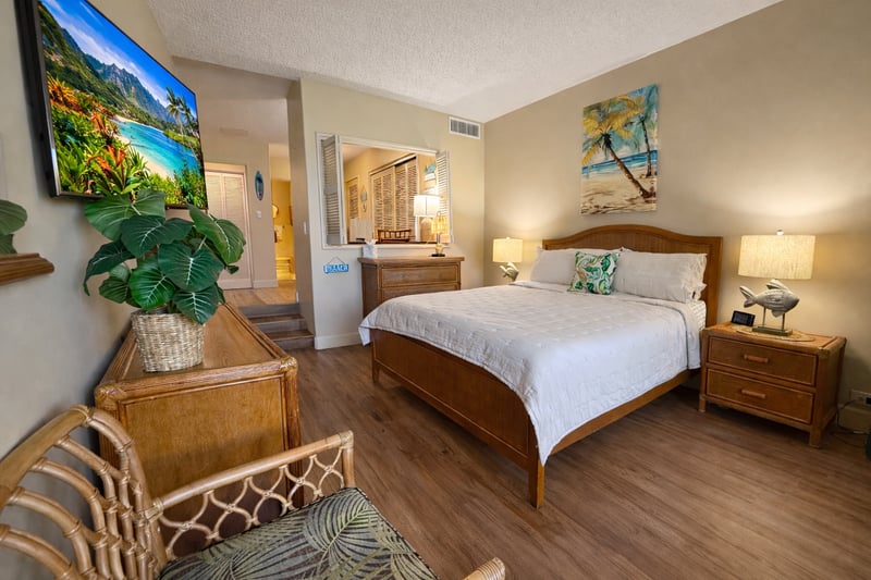 The spacious primary suite features a comfortable king size bed with premium linens