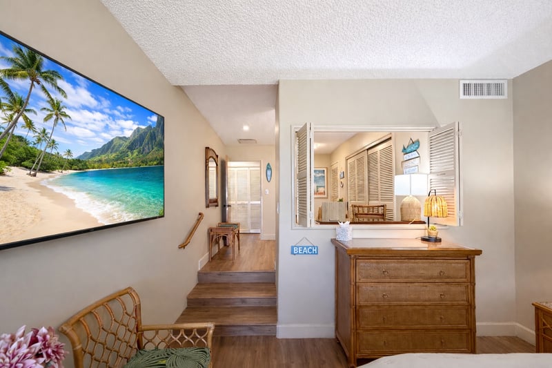 The primary suite features a private desk area, perfect for traveling professionals