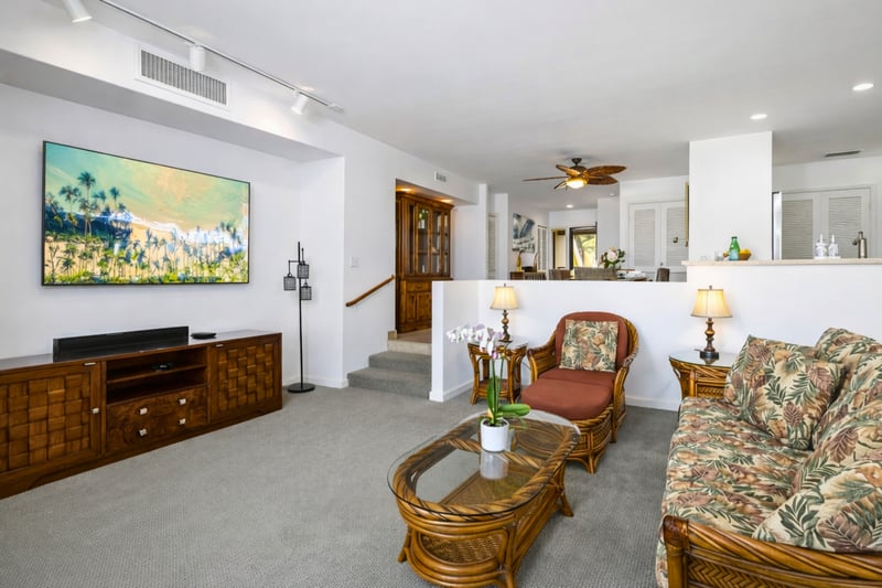 Plush palms, red pops, and a tropical breeze, this room says stay, play, and soak up the Maui magic