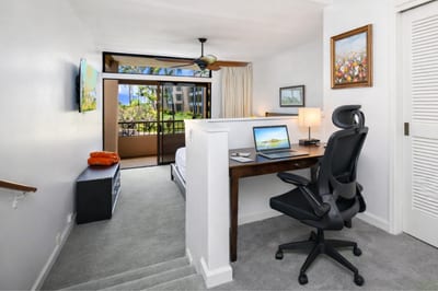 A dedicated desk and chair in your primary suite make remote work simple, keeping productivity close to your personal space.