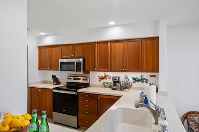 Smooth counters, gleaming appliances, and coconut-colored cabinets make this space a chef’s island daydream