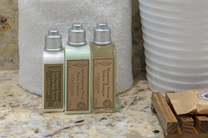 Luxurious L’Occitane toiletries and plush towels for spa-like comfort.