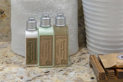 Luxurious L’Occitane toiletries and plush towels for spa-like comfort.
