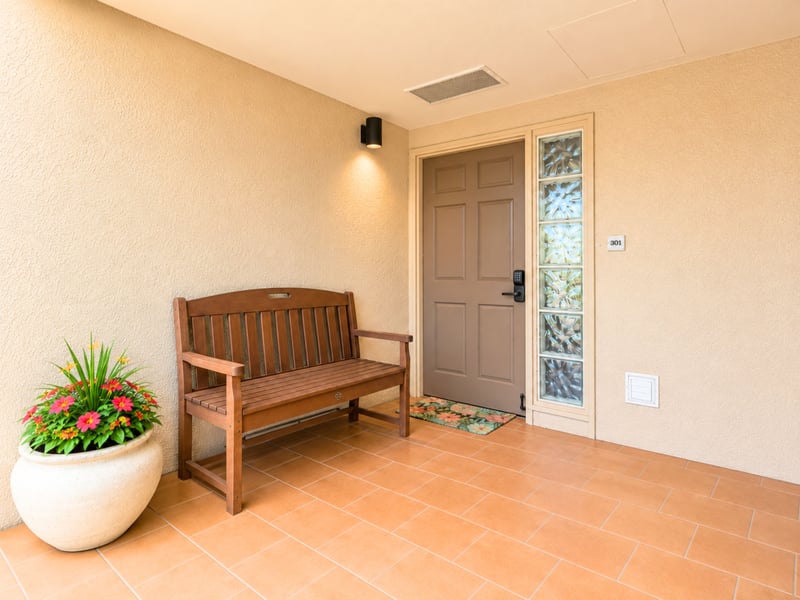 A private entry welcomes you to unit 301 at Kaanapali Royal, with keyless entry and a bench for setting down your bags.