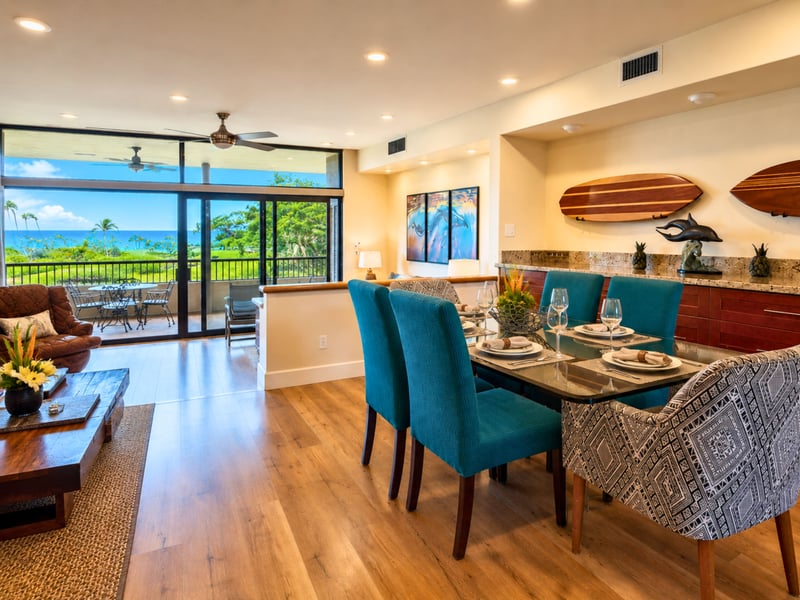The dining table seats up to 6 with a wet bar and ocean view just steps away.