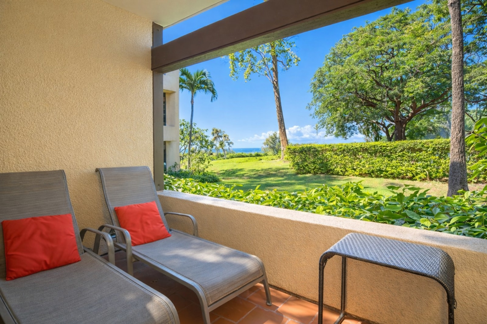 Unwind on this tranquil lanai, where garden views, fresh breezes, and peaceful vibes define your island stay 