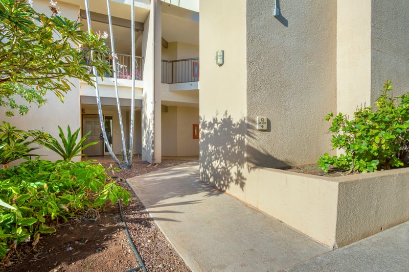 Framed by swaying palms and sun-kissed paths, this private entrance invites you into your tranquil escape