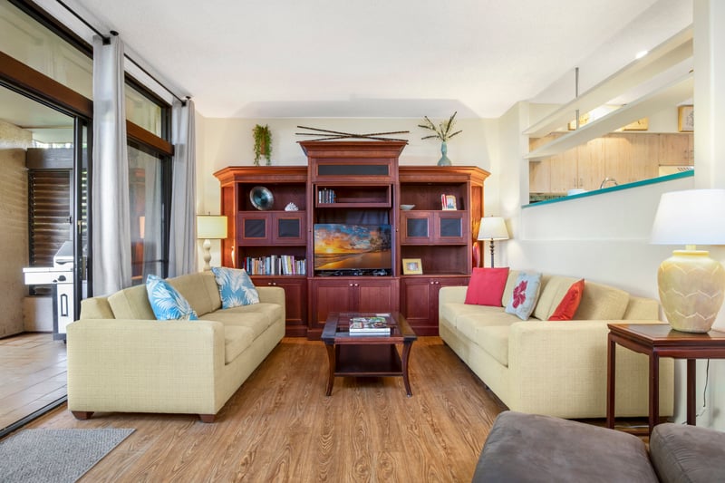 Relax beneath golden shelves and wood-warm glow—steps away from the lanai and its leafy serenade