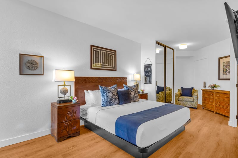 The beautifully designed primary bedroom features premium bedding and a serene, restful ambiance