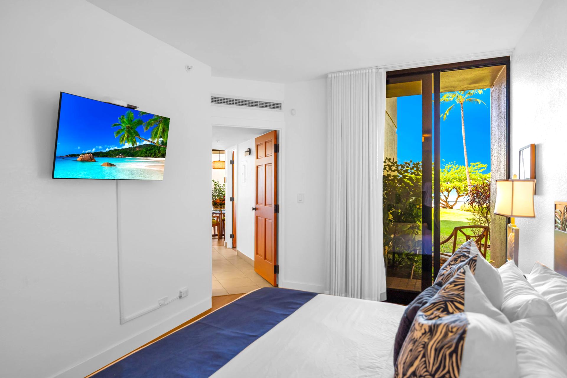 Your luxurious primary bedroom features a king size bed and private lanai