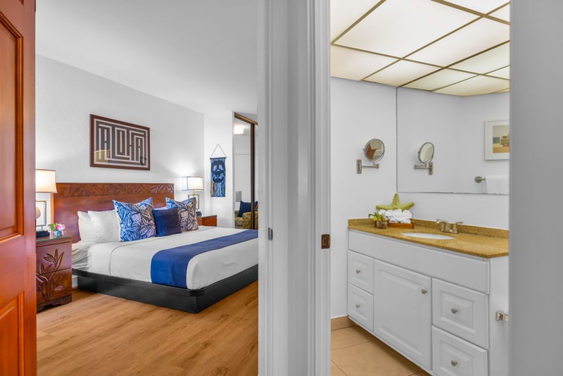 The ensuite bathroom adds privacy to the primary bedroom