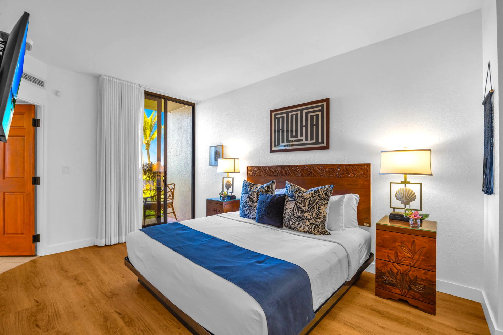 Wake up refreshed in the stunning primary bedroom, where comfort meets breathtaking tropical surroundings