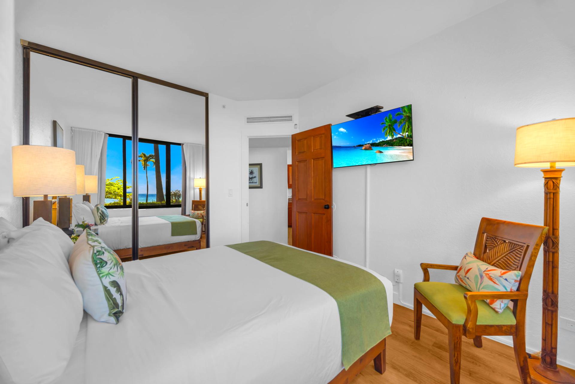 The serene guest bedroom offers plush bedding and a peaceful retreat after island adventures