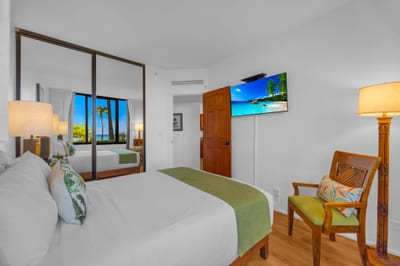 The serene guest bedroom offers plush bedding and a peaceful retreat after island adventures KS-104