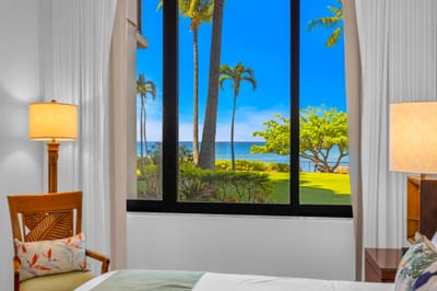 The sunlit guest bedroom features gorgeous views KS-104