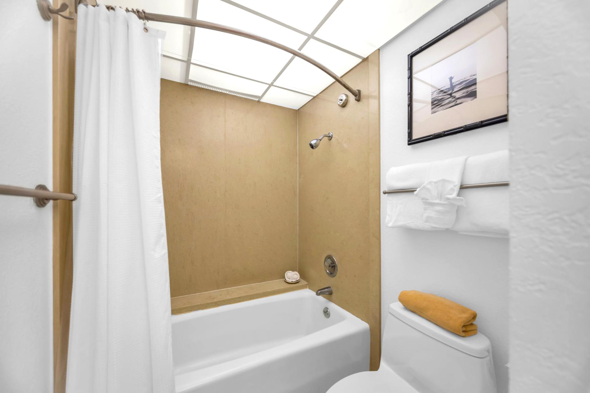 The ensuite bathroom features a shower/tub combination for convenience
