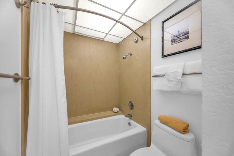 The ensuite bathroom features a shower/tub combination for convenience
