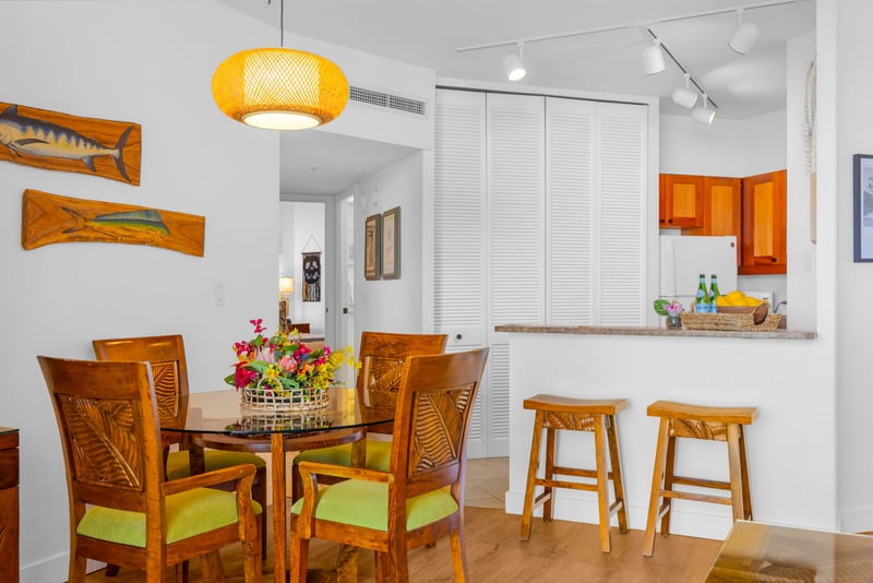 Gather around the dining table for memorable meals with tropical island ambiance