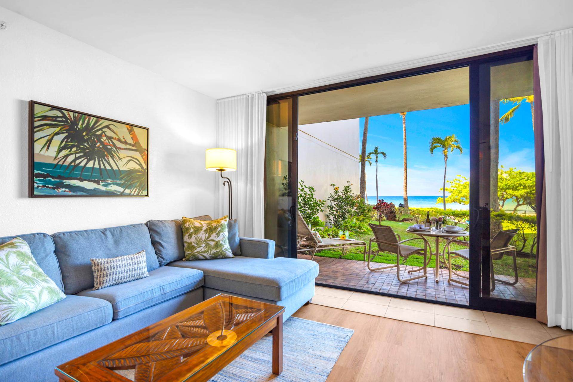 The bright and airy living space flows seamlessly to stunning ocean views through expansive doors