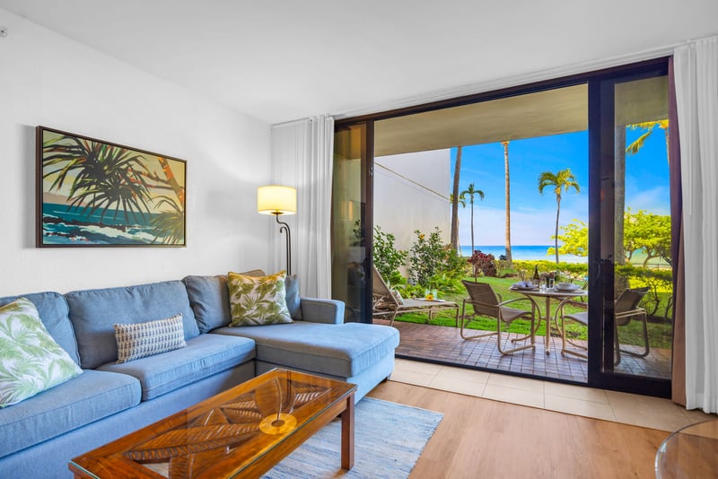 The bright and airy living space flows seamlessly to stunning ocean views through expansive doors