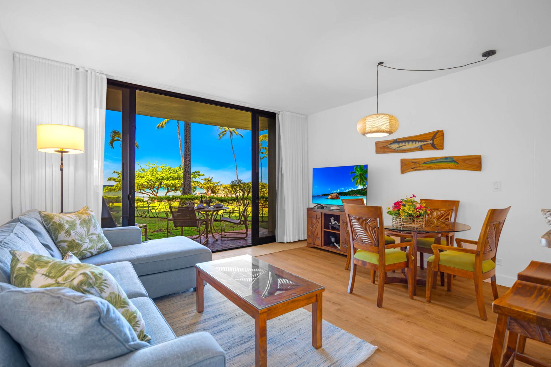 Elegant coastal furnishings and abundant natural light make this living room perfect for relaxing