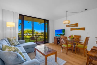 Elegant coastal furnishings and abundant natural light make this living room perfect for relaxing KS-104