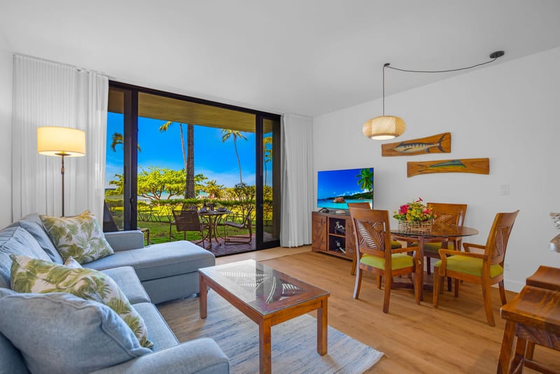 Elegant coastal furnishings and abundant natural light make this living room perfect for relaxing KS-104