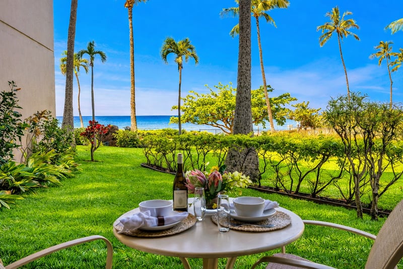 Sip your morning coffee surrounded by swaying palms and ocean breezes on your lanai KS-104