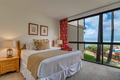 From playful paisleys to palm-view windows, this bedroom pairs cheerful charm with comfort and lanai bliss