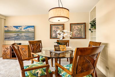 Tropical florals meet wood-carved elegance in this cozy corner where dinner feels like a breezy island celebration