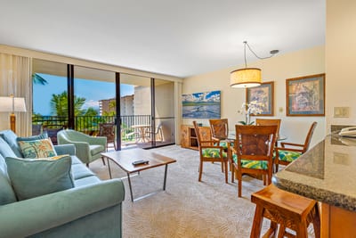 Palm-framed sunsets await beyond glass doors, while seafoam blues invite island daydreams inside
