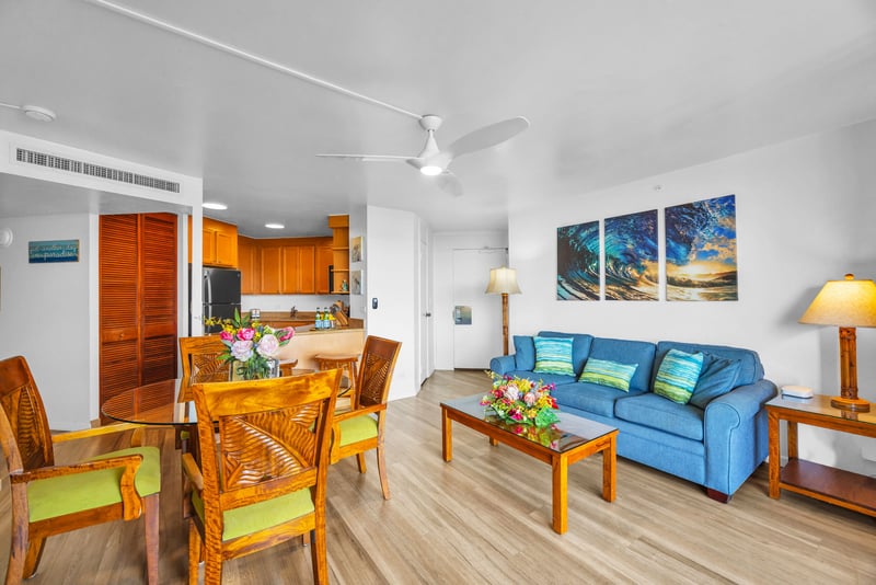 Island-inspired living room with bright, beachy tones and comfortable seating, including a sofa sleeper for added flexibility.