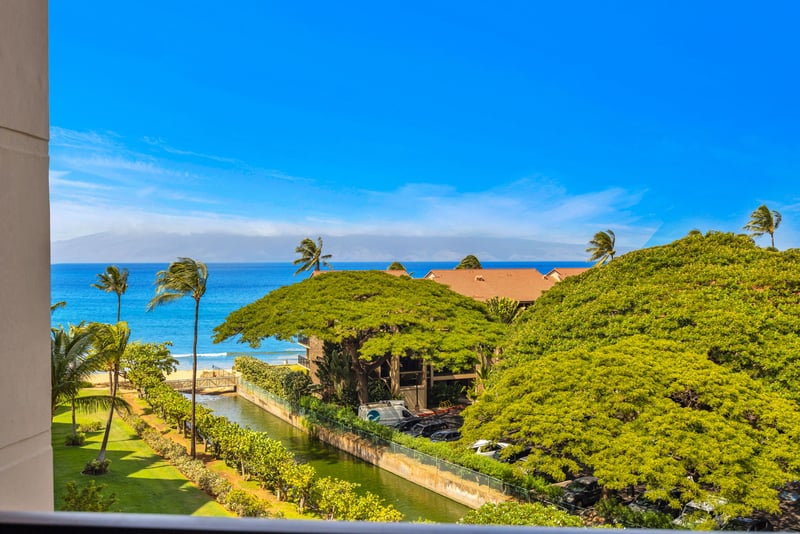 Expansive views of the Pacific and lush tropical canopy below, with a peek at the golden shoreline just moments from your door.