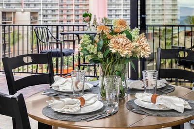 This chic balcony offers a scenic blend of ocean, sky, and resort gardens—perfect for al fresco dining in style