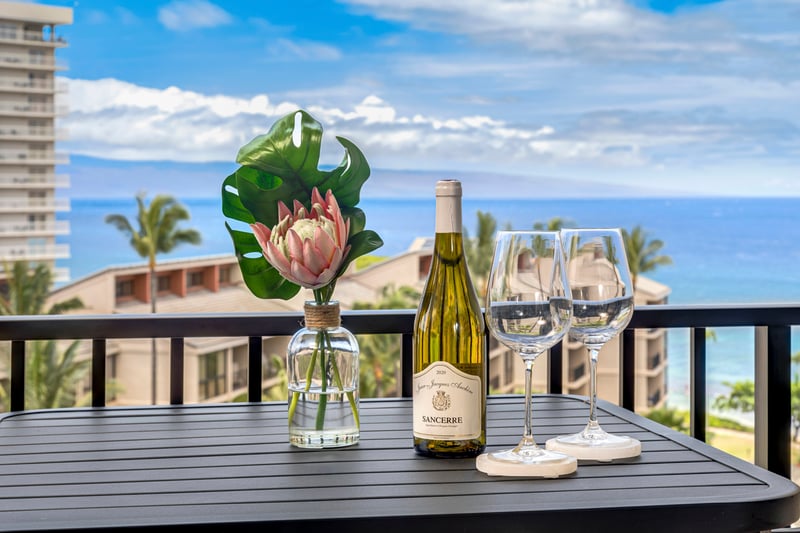 Dine in elegance above the palms with ocean breezes, skyline views, and the charm of tropical floral arrangements