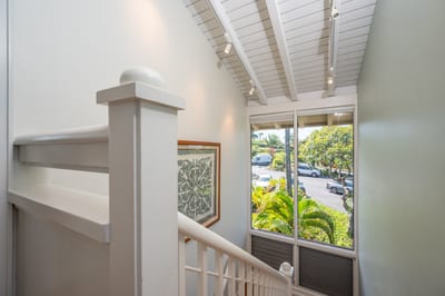 Sunlit and serene, this airy stairway welcomes you with tropical garden views and a warm island vibe KBV-12B3