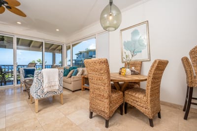 With earthy tones and coastal textures, this dining nook blends perfectly into the warm, open-concept beach retreat KBV-12B3