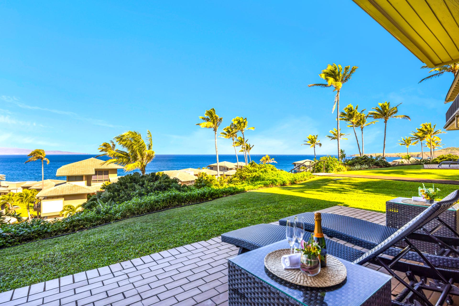Peaceful lanai moments overlooking green lawns and blue water